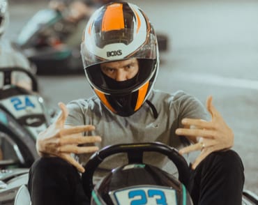 Man in a helmet in a go-kart